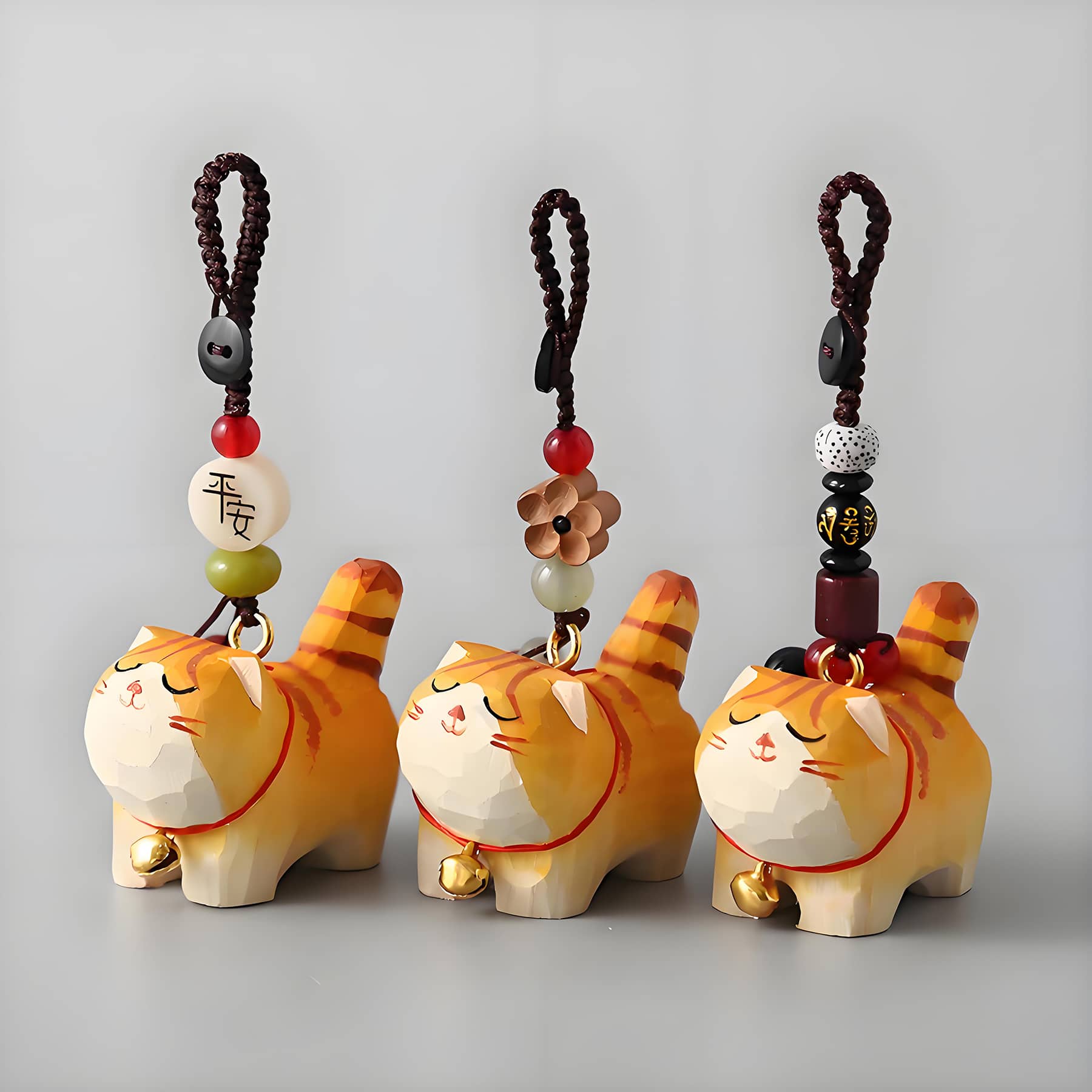 3 orange cat charms front view