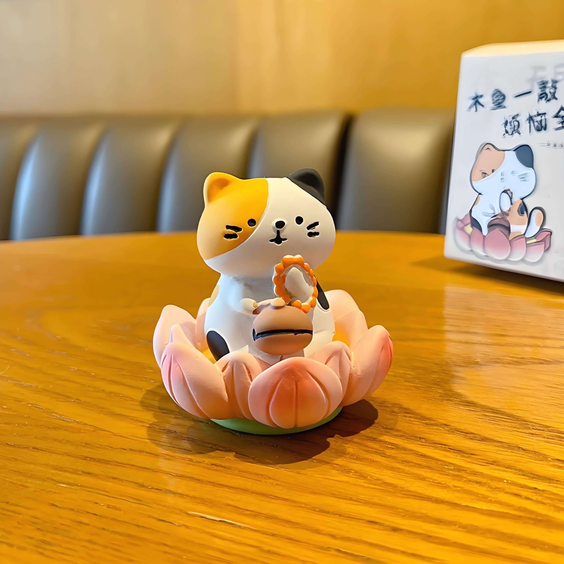 a cute calico cat figure on the yellow table
