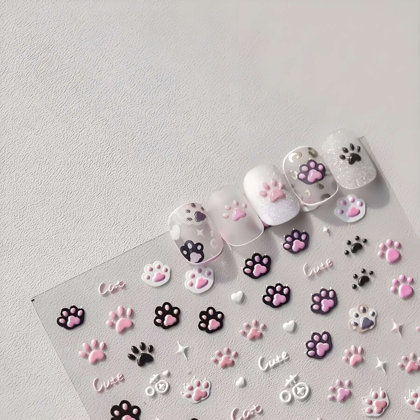 black white cat paw demonstrate on faked nails are pretty