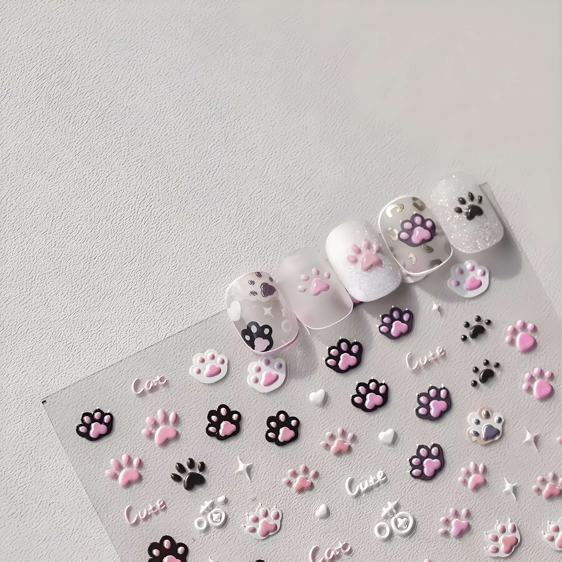 black white cat paw demonstrate on faked nails are pretty